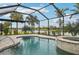 Inviting pool and spa with screened enclosure, overlooking a tranquil lake at 13280 Esposito St, Venice, FL 34293