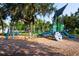 Modern playground with play structures, swings at 1493 Navigator Rd, Punta Gorda, FL 33983