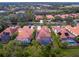 Aerial view of community with houses and pools at 1720 Grande Park Dr, Englewood, FL 34223