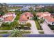 Aerial view of upscale community with houses and palm trees at 1720 Grande Park Dr, Englewood, FL 34223
