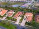 Aerial view showcasing a house's location within a neighborhood at 1720 Grande Park Dr, Englewood, FL 34223