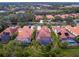 An aerial view of a home with a pool and surrounding houses at 1720 Grande Park Dr, Englewood, FL 34223
