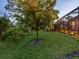 Landscaped backyard with a pool and lighting at 1720 Grande Park Dr, Englewood, FL 34223