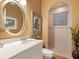 Elegant bathroom with double vanity, walk-in shower, and updated fixtures at 1720 Grande Park Dr, Englewood, FL 34223