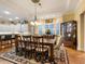 Bright dining room with table for six and access to the patio at 1720 Grande Park Dr, Englewood, FL 34223