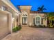 Front entrance with double doors and a welcoming courtyard at 1720 Grande Park Dr, Englewood, FL 34223