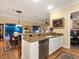 Kitchen with island, granite countertops, and stainless steel appliances at 1720 Grande Park Dr, Englewood, FL 34223