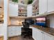 Built-in corner desk with granite countertop, ideal home office space at 1720 Grande Park Dr, Englewood, FL 34223
