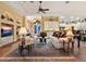 Open living room with hardwood floors, comfortable seating and views to kitchen and patio at 1720 Grande Park Dr, Englewood, FL 34223