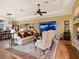 Comfortable living room featuring hardwood floors and access to a patio at 1720 Grande Park Dr, Englewood, FL 34223