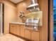 Modern outdoor kitchen featuring stainless steel appliances and granite countertops at 1720 Grande Park Dr, Englewood, FL 34223