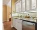 Wet bar with granite countertop, sink, and mini-refrigerator at 1720 Grande Park Dr, Englewood, FL 34223