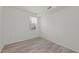 Empty bedroom with light walls and wood-look floors at 17585 Boracay Ct # 101, Venice, FL 34293