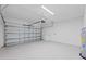 Garage with an automatic door opener at 17585 Boracay Ct # 101, Venice, FL 34293