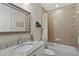 Clean bathroom with a tub, shower, and granite countertop at 187 Nolen Dr, Venice, FL 34292