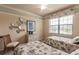 Two twin beds in a bedroom with seashell bedding at 20121 Lagente Cir, Venice, FL 34293