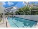 Large screened in pool with patio furniture at 20263 Hamilton Ave, Port Charlotte, FL 33952