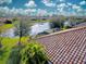 Tile roof and lake view from home's back at 20272 Tesoro Dr, Venice, FL 34293