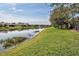 Community lakefront view with several houses at 20272 Tesoro Dr, Venice, FL 34293