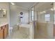 Elegant bathroom with a walk-in shower and a corner tub at 20272 Tesoro Dr, Venice, FL 34293