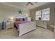 Bright bedroom with white furniture and blue bedding at 20272 Tesoro Dr, Venice, FL 34293