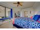 Spacious bedroom with a built-in window seat and access to a balcony at 20272 Tesoro Dr, Venice, FL 34293