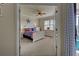 Spacious bedroom with a white bed frame and blue bedding at 20272 Tesoro Dr, Venice, FL 34293