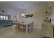 Dining room with a large table, six chairs, and access to the kitchen at 20272 Tesoro Dr, Venice, FL 34293