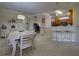 Dining area with kitchen bar and view into home office at 20272 Tesoro Dr, Venice, FL 34293