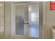 White double doors with etched glass design at 20272 Tesoro Dr, Venice, FL 34293