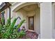 Inviting front entrance with decorative door and potted plants at 20272 Tesoro Dr, Venice, FL 34293