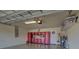 Garage with storage cabinets and work bench at 20272 Tesoro Dr, Venice, FL 34293