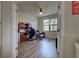 Bright home office features built-in shelving and hardwood floors at 20272 Tesoro Dr, Venice, FL 34293