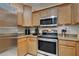 Kitchen boasts stainless steel appliances and granite countertops at 20272 Tesoro Dr, Venice, FL 34293