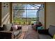 Relaxing screened patio with wicker furniture at 20272 Tesoro Dr, Venice, FL 34293