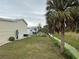 Backyard view of mobile home and canal at 223 Roma Rd, Venice, FL 34285