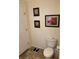 Small bathroom with toilet and scale at 223 Roma Rd, Venice, FL 34285