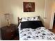 Cozy bedroom featuring a full-size bed with black and white bedding at 223 Roma Rd, Venice, FL 34285