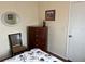 Bedroom with a dresser, chair, and window at 223 Roma Rd, Venice, FL 34285