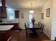 Dining area with dark wood table and four chairs at 223 Roma Rd, Venice, FL 34285