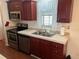 Well-equipped kitchen featuring stainless steel appliances at 223 Roma Rd, Venice, FL 34285