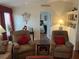 Relaxing living room with two armchairs and view to bedroom at 223 Roma Rd, Venice, FL 34285