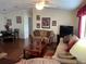 Spacious living room featuring comfortable seating and a large TV at 223 Roma Rd, Venice, FL 34285