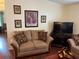 Living room with cozy seating and decorative wall art at 223 Roma Rd, Venice, FL 34285