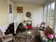 Cozy screened porch with seating and plants at 223 Roma Rd, Venice, FL 34285