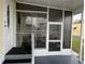 Spacious screened porch with seating area at 223 Roma Rd, Venice, FL 34285