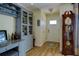 Bright entryway with hardwood floors, built-in shelving, and a grandfather clock at 2295 Hibiscus St, Sarasota, FL 34239