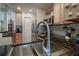 Modern kitchen with stainless steel sink and faucet, granite countertop at 2295 Hibiscus St, Sarasota, FL 34239