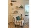 Living room featuring comfy chair and built-in shelves at 232 Saint Augustine Ave # 404, Venice, FL 34285