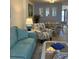 Light and airy living room with seating area and dining table at 232 Saint Augustine Ave # 404, Venice, FL 34285
